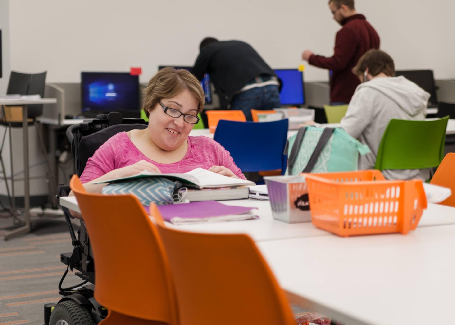 A female student in Updike Hall studying