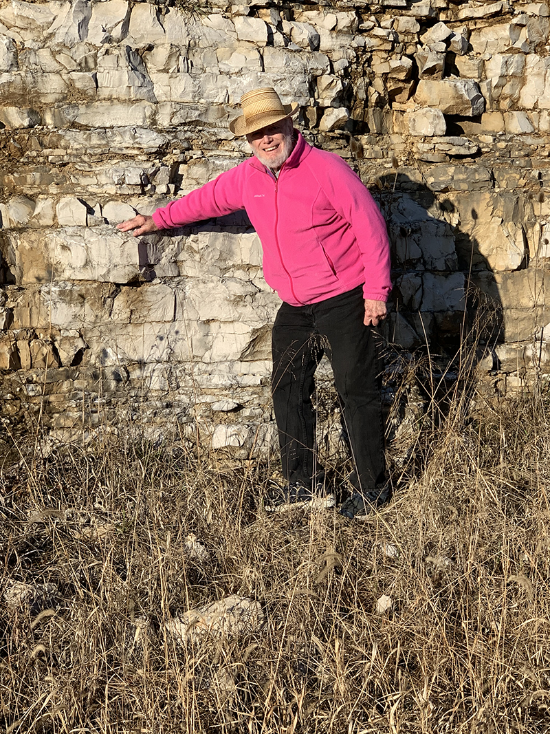 Robert Metz leaning against a wall